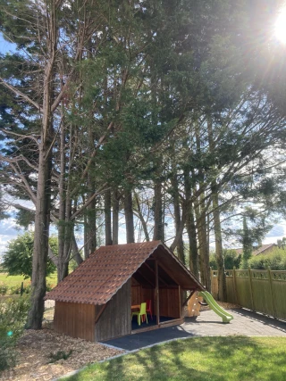 Children's playhouse in the private garden of the gîte Le Benouchon