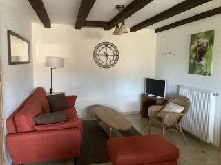 Sitting area in the gîte Le Benouchon